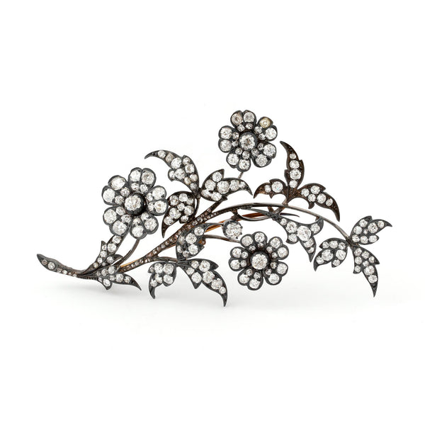 An antique gold and diamond en tremblant flower brooch